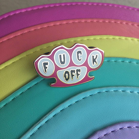 Fuck off brass knuckles enamel pin - Radical Buttons