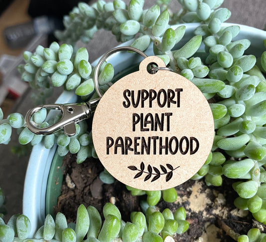 Support plant parenthood wooden keychain