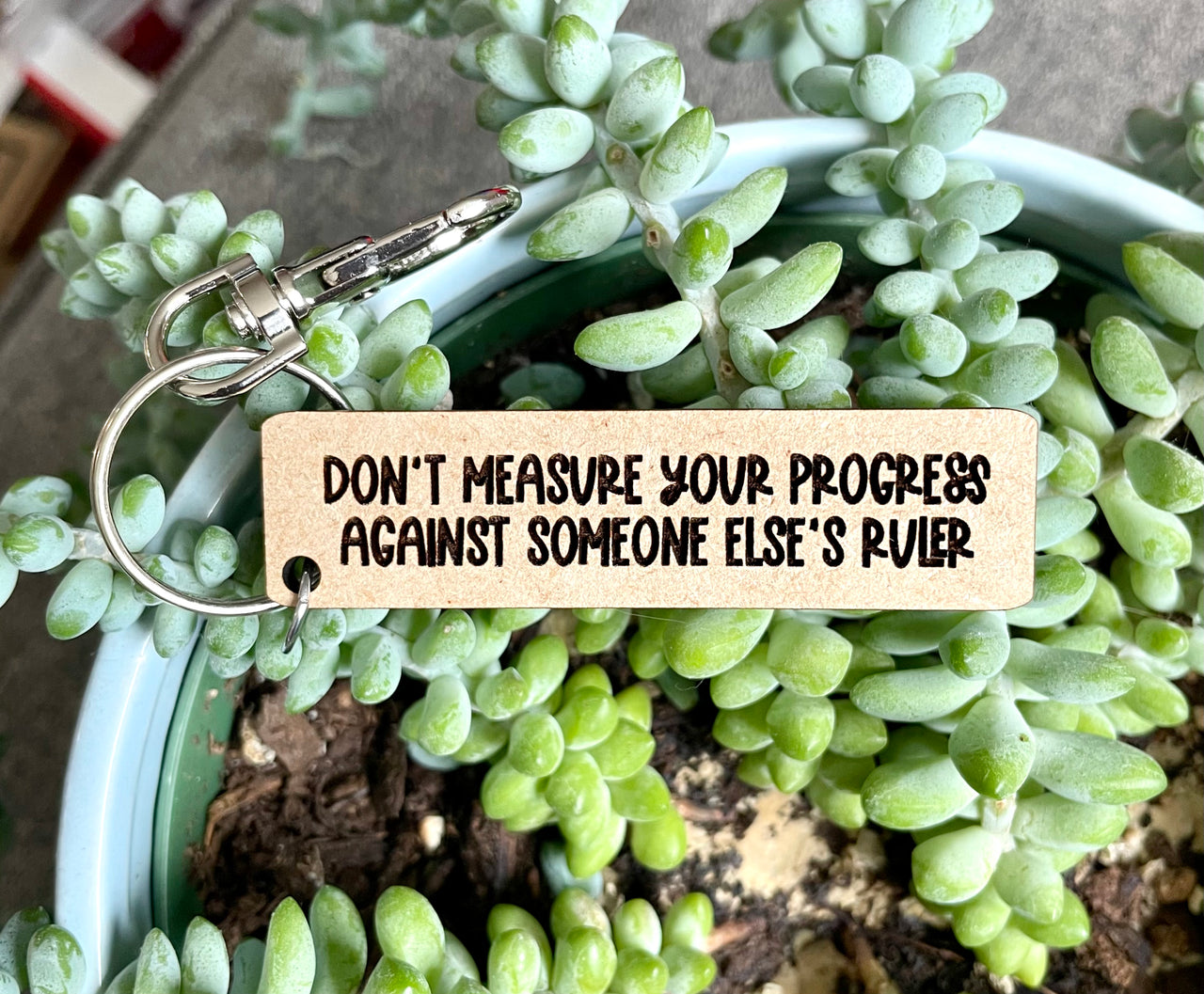 Don’t measure your progress against someone else’s ruler keychain